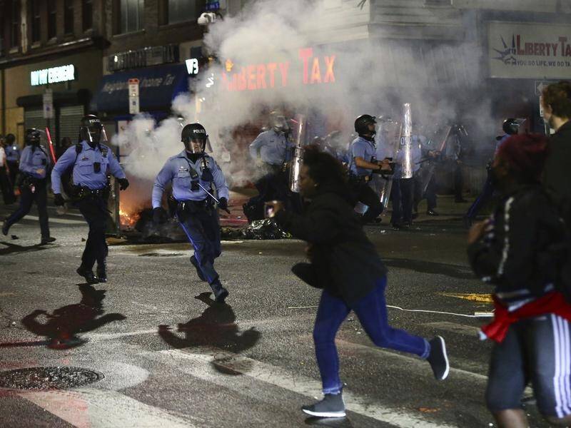 Police and protesters clash in Philadelphia after the fatal police shooting of a black man.