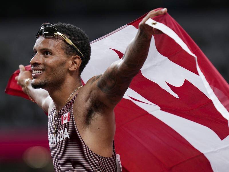 Canada speedster Andre De Grasse celebrates his 200 metres triumph at the Olympics.