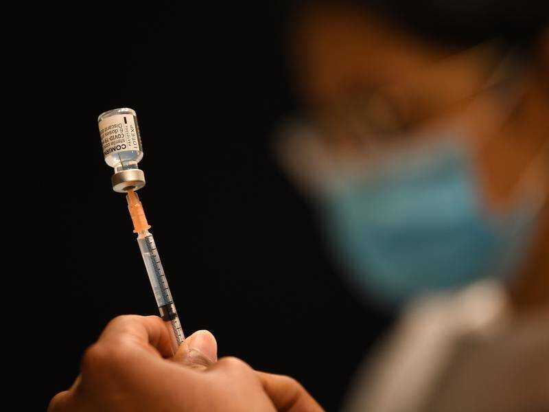 Epidemiologists are questioning the retention of double-dose COVID vaccination mandates for workers.