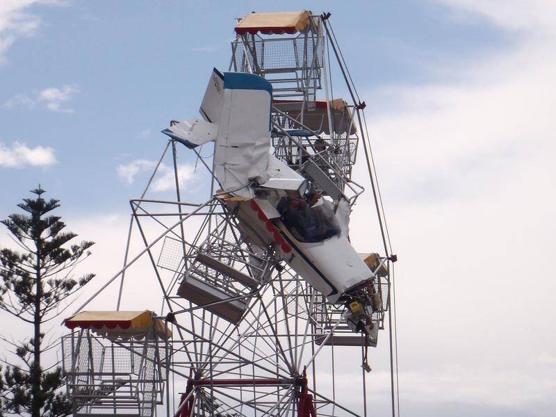 A woman who was 13 when a plane struck the Ferris wheel she was on has been awarded $1.5m damages.