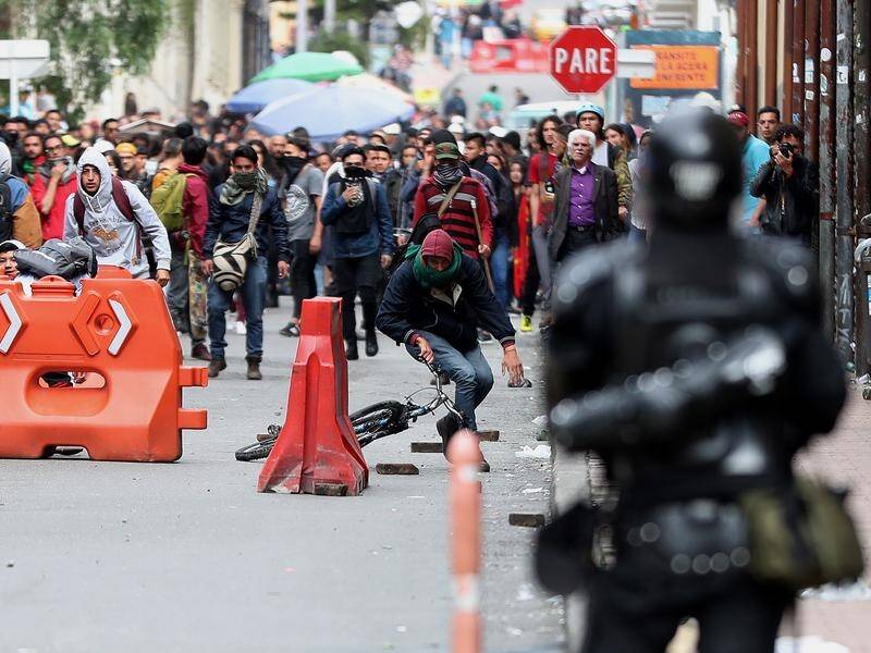 Protesters in Bogota threw stones and other objects at police, who responded by firing tear gas.