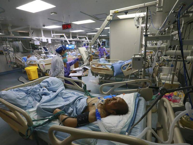 Hospitals in China are being swamped with COVID-19 patients after strict virus restrictions eased. (AP PHOTO)