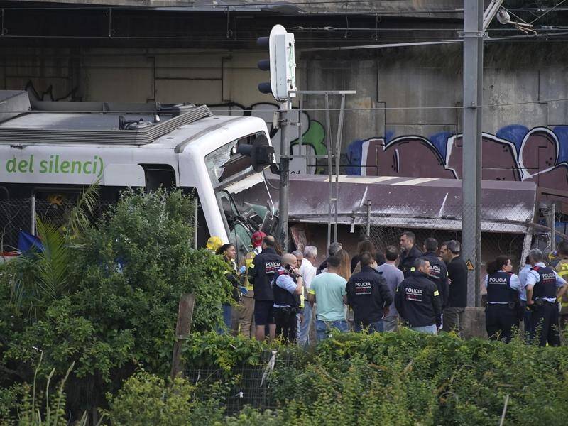 Two trains have crashed outside Barcelona, leaving at least one person dead.
