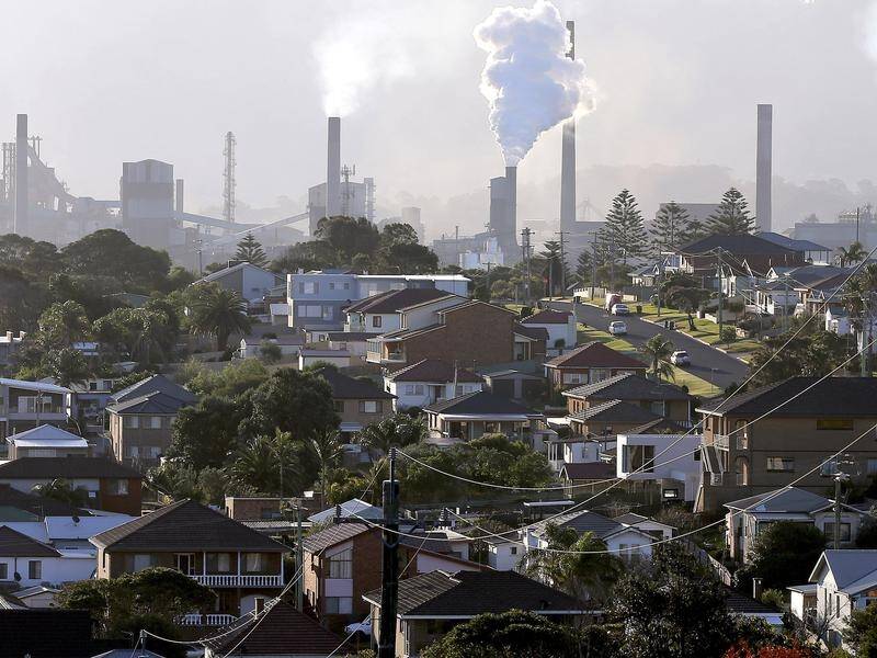 A review says industry should be able to trade away emissions by investing in overseas projects. (AP PHOTO)