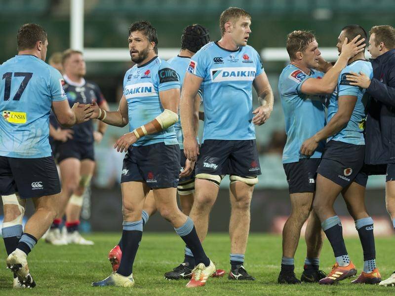 Waratahs players celebrate their round 10 Super Rugby win over the Melbourne Rebels.
