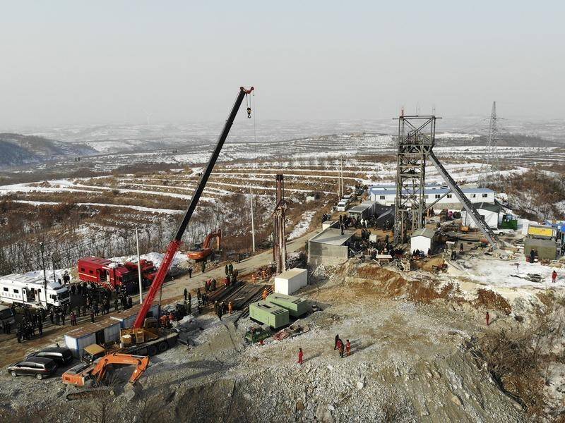 Reports say at least 12 people are still alive after an explosion at a mine in China one week ago.