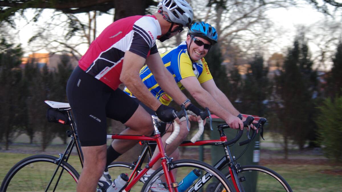 Mike Stone (red jersey) and Greg Doman, organisers of the ride for cancer research.