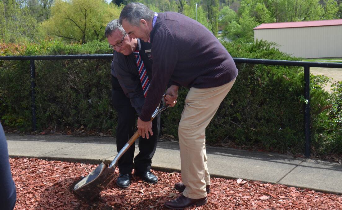 SOD TURNING: Armidale SerVies CEO Scott Sullivan and Armidale Regional Council Mayor Simon Murray ceremoniously bent their backs for the new project.