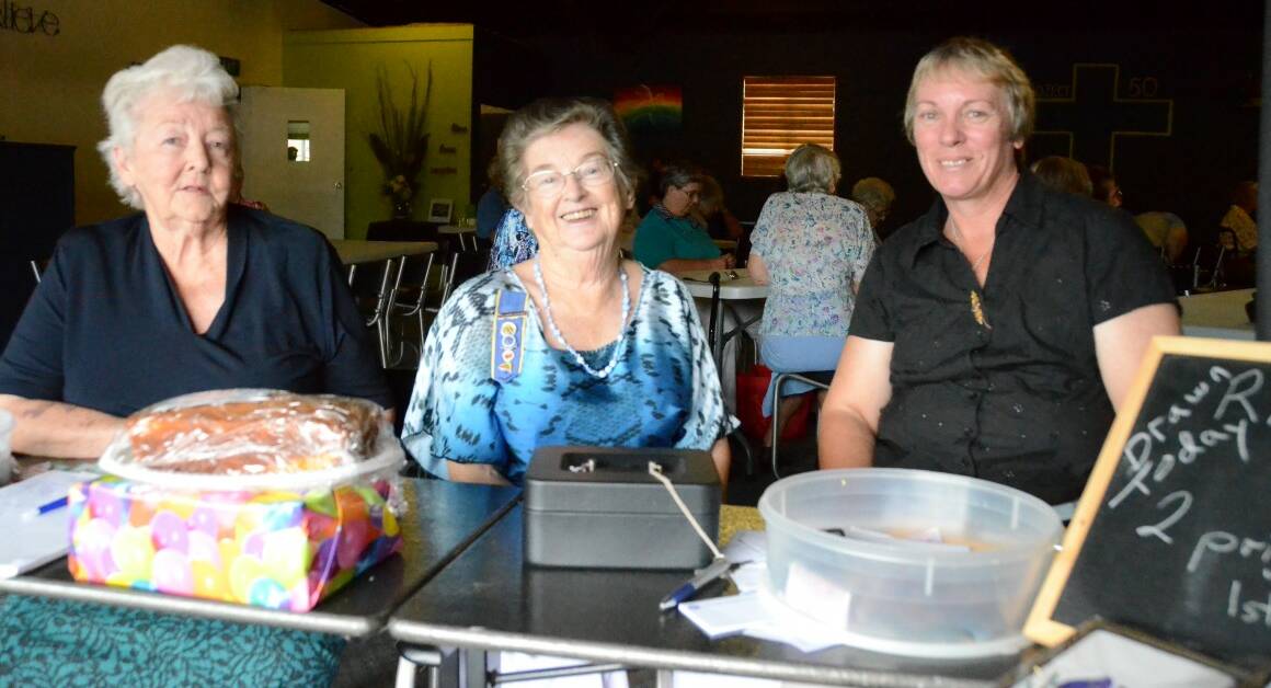 WELCOMING: Patricia Wright and Fay Macartney from Myall Creek, together with Gwydir Group treasurer Mary Shepherd made sure new visitors were looked after at the entrance. Photo by Renate Moerman No 15