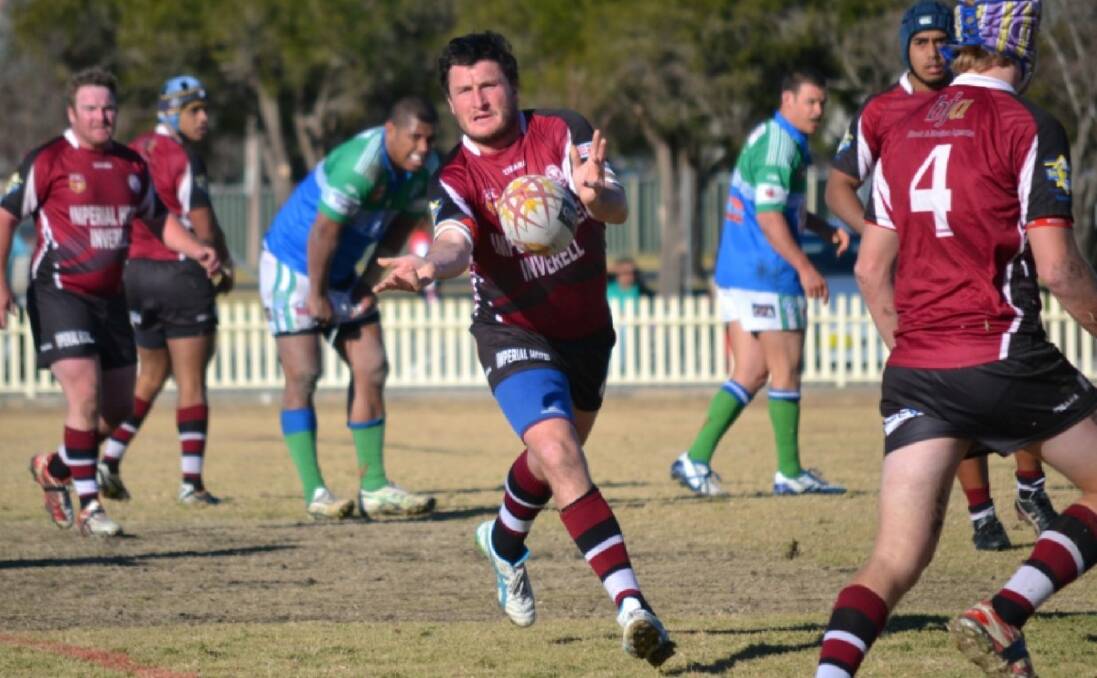 SETTING UP THE PLAY: Rod Bull gets a pass away during Saturday’s match against Armidale. 