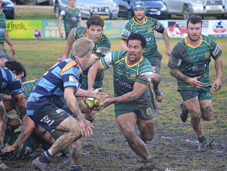 DOWN AND DIRTY: Siaki Maea is about to share some mud with the Scone Brumbies defence.