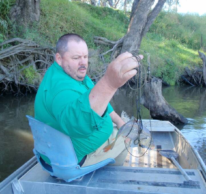CATCH: A set line baited with live Carp was located by Detective Senior Constable Gavin Berry during the operation.