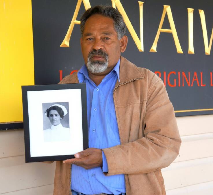 RESPECT: Anaiwan LALC CEO Greg Livermore with the photo of Nurse May Yarrowick.
