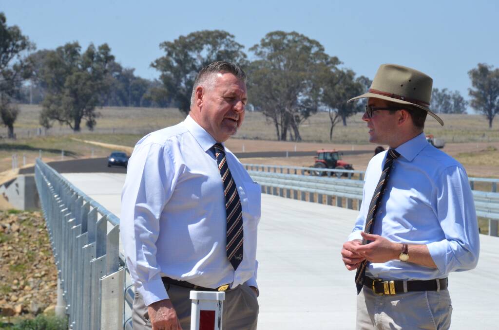Uralla Mayor Michael Pearce and Member for Northern Tablelands Adam Marshall chat about the advantages the new bridge at Bundarra holds.