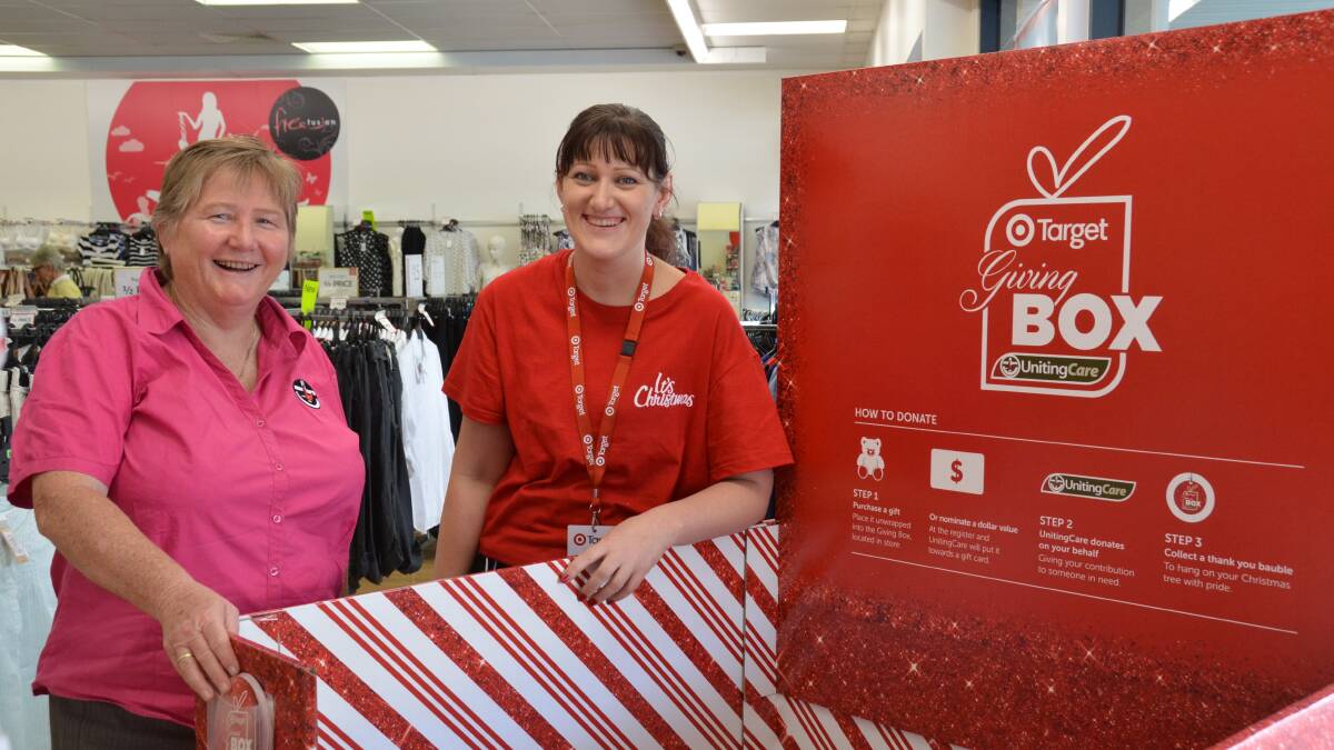 GIVE MORE THIS SEASON: Reverend Jean Bell with target manager Samantha Hoffman beside this year's giving box.