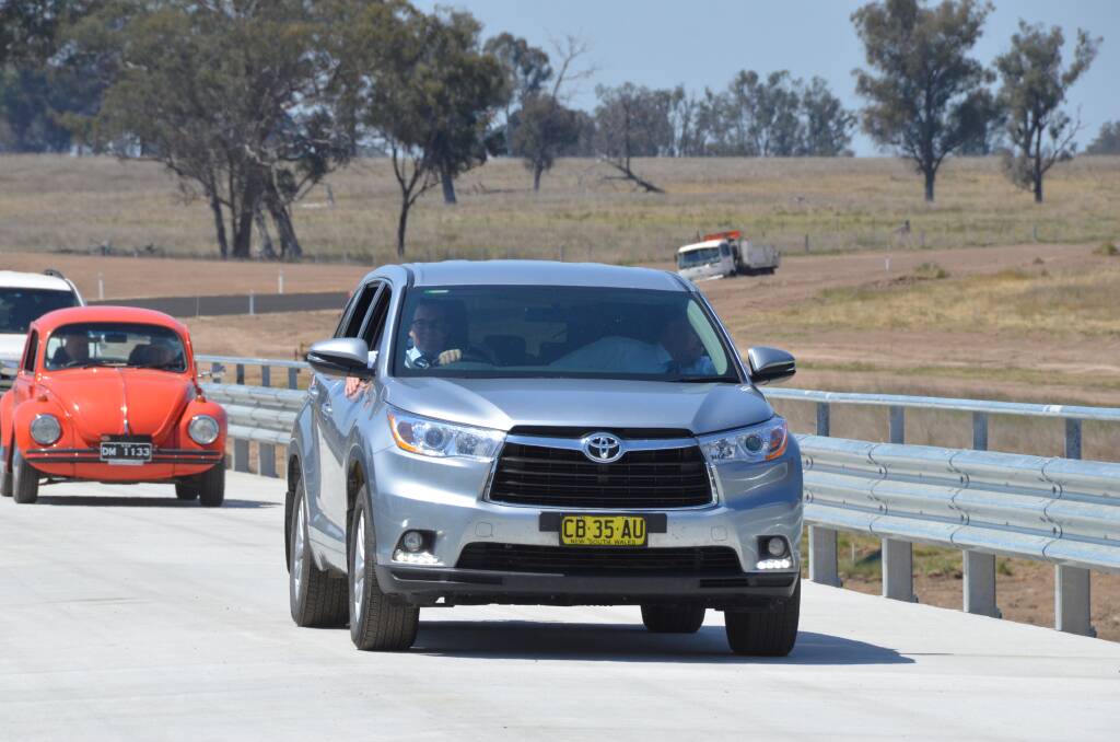 Member for Northern Tablelands Adam Marshall and Uralla Mayor Michael Pearce are first to drive across the new Emu Crossing Bridge at Bundarra.