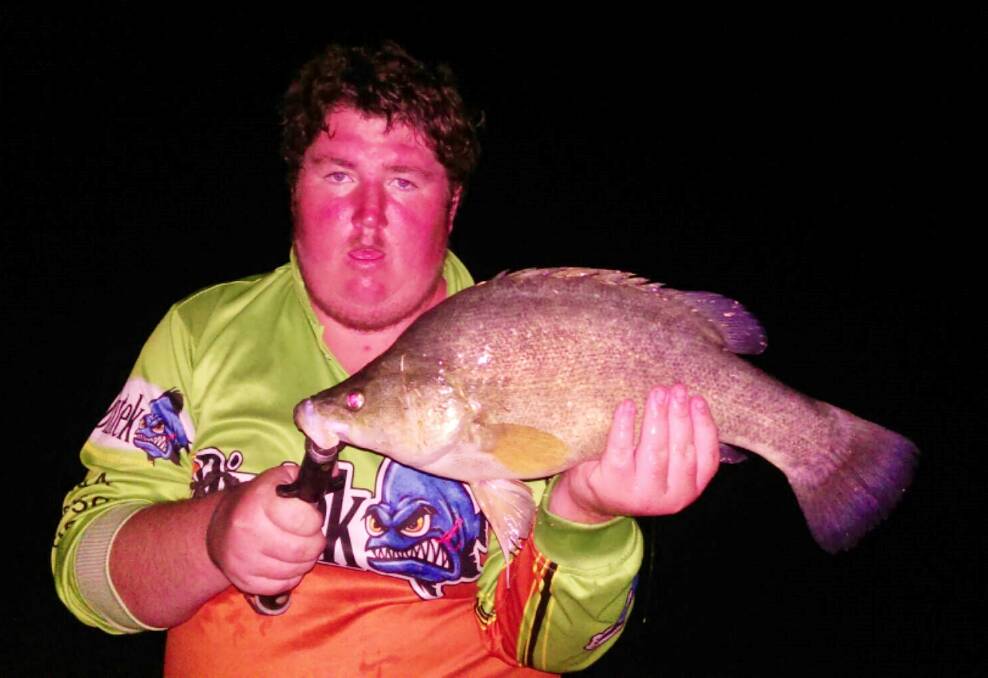 FISH FINDER: Zac Conn with one of the Yellow Belly that contributed to his winning bag.