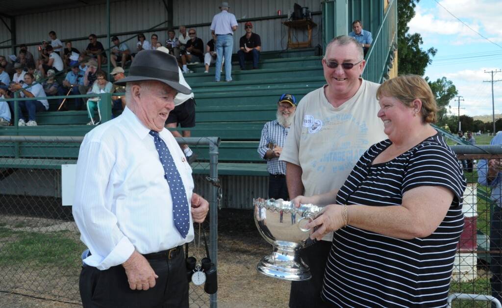 HISTORY: Brian Baldwin accepts the Kato Cup from Debbie Berger. Debbie was donating part of this district’s pacing history to be perpetually enjoyed by others.