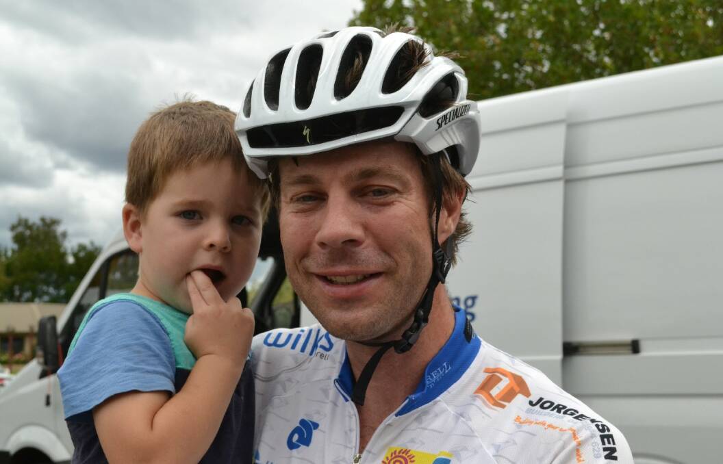Riley Alexander was happy to snuggle with dad Lee after the ride.