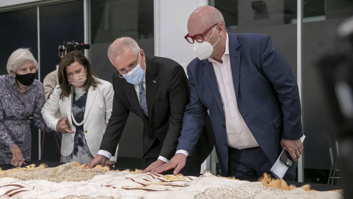 Prime Minister Scott Morrison admires First Nations art works at the Australian Institute of Aboriginal and Torres Strait Islander Studies (AIATSIS) during his announcement of the Ngurra Aboriginal and Torres Strait Islander Cultural Precinct. Picture: Keegan Carroll
