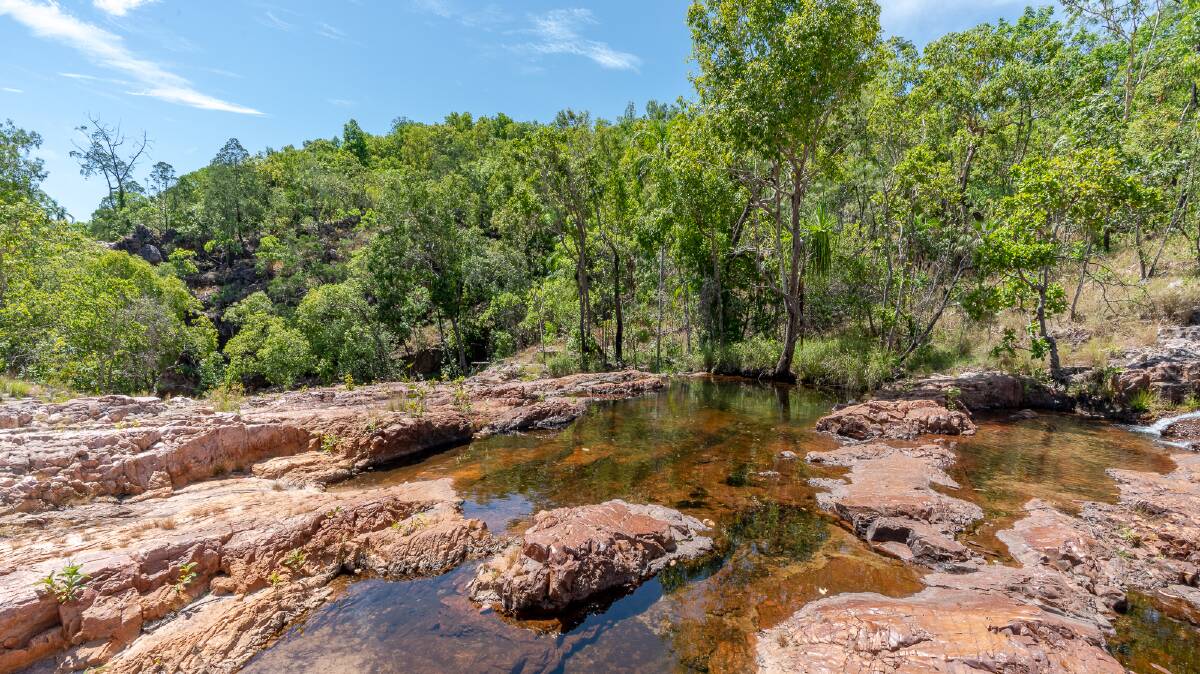 Water flows from the wetlands at the top of the sandstone plateau. Picture: Michael Turtle