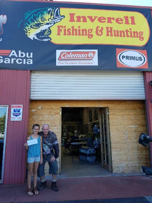 Nice catch: Kayla collecting her prize donated by Inverell Fishing and Hunting.