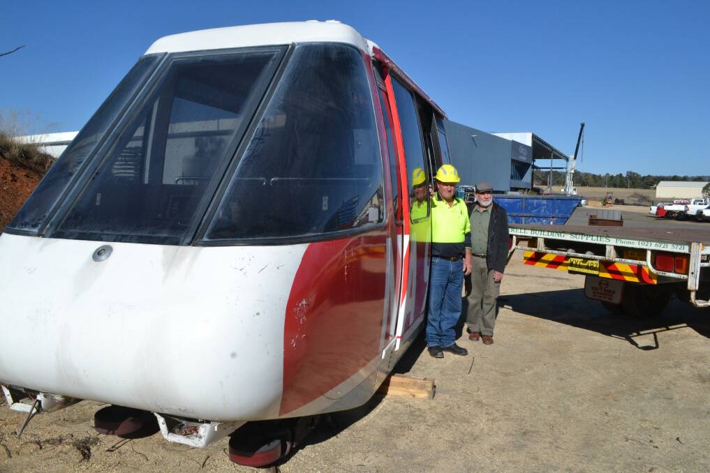 Ron Cameron from Inverell Building Supplies and Kevin Dunn from the Transport Museum beside the first carriage of the monorail, soon to be on display at the museum's new location.
