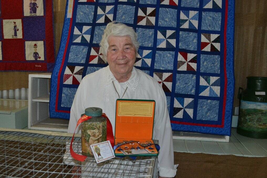 Beryl Julius with her winning entries of a Tea Caddy and spoon collection in the Antiques Section.