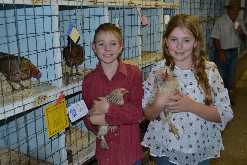 Corey Scriven won 1st prize with his Heinz Variety hen, Jodee Scriven won an achievement award for her Frizzl Rooster.
